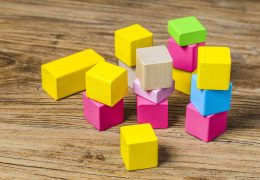 Building blocks on wooden background，Colorful wooden building blocks