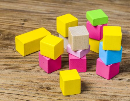 Building blocks on wooden background，Colorful wooden building blocks